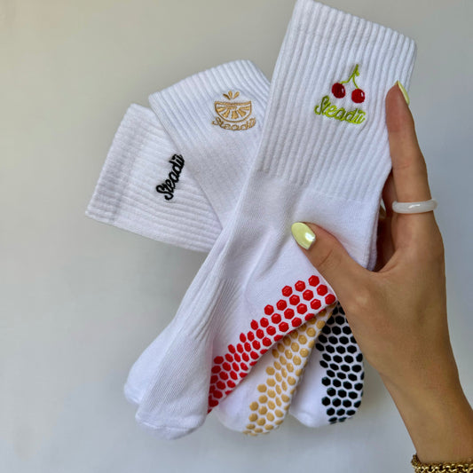 Three-pack of premium Reformer Pilates socks with non-slip grip and sweat wicking, offering comfort, support, and style for your Pilates practice. Perfect for every workout.